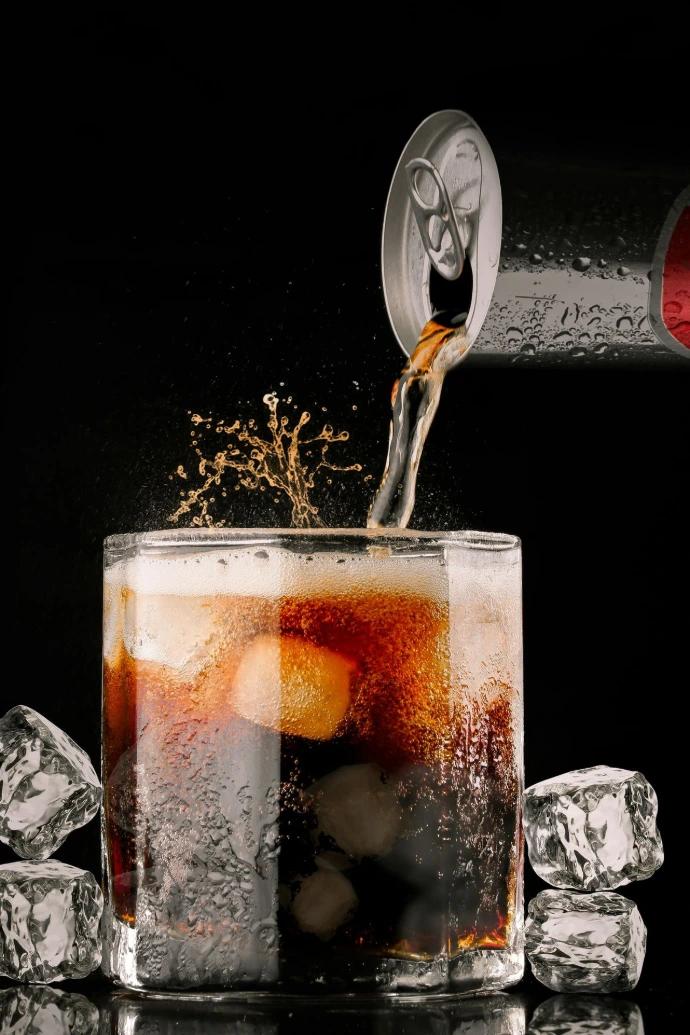 clear drinking glass with brown liquid